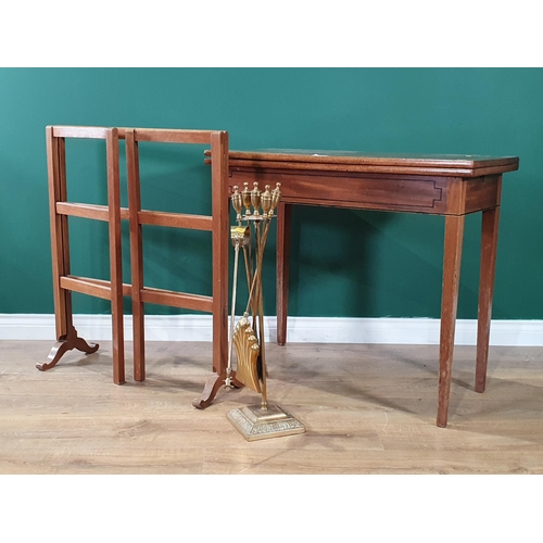 672 - A mahogany Fold over Card Table with inlaid decoration, on square tapered supports, 29