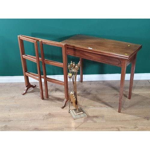 672 - A mahogany Fold over Card Table with inlaid decoration, on square tapered supports, 29