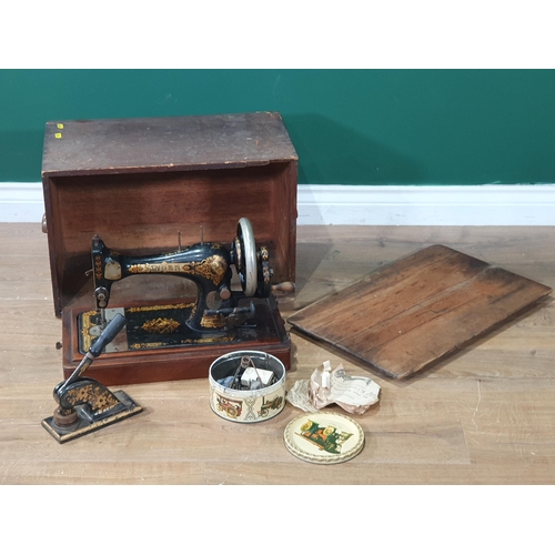 678 - A vintage Singer Sewing Machine No - 16155369, in painted carry case. (R9).