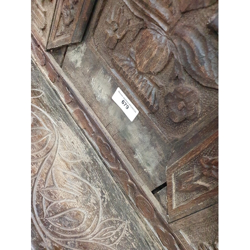 679 - An antique carved oak Tridarn with open bars to the sides of the upper section, fitted a pair of cup... 