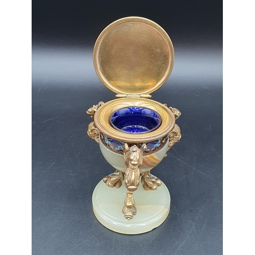 68 - A gilt metal and champleve enamel mounted Inkwell and Cover with three griffin scroll supports on ci... 