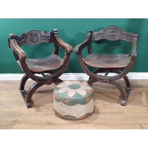 684 - A pair of reproduction leather seated Throne Chairs with carved armorial decoration A/F and a leathe... 