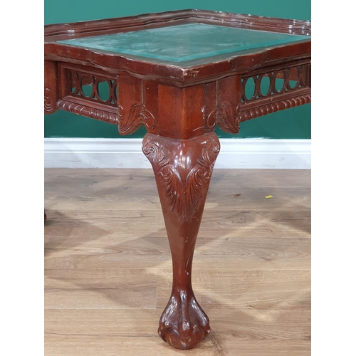 690 - A pair of reproduction mahogany glass topped Coffee Tables on claw and ball supports, A/F, 21