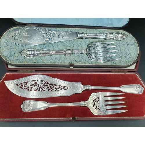 96 - Two pairs of plated Fish Servers engraved anglers, birds and leafage scrolls, both cased