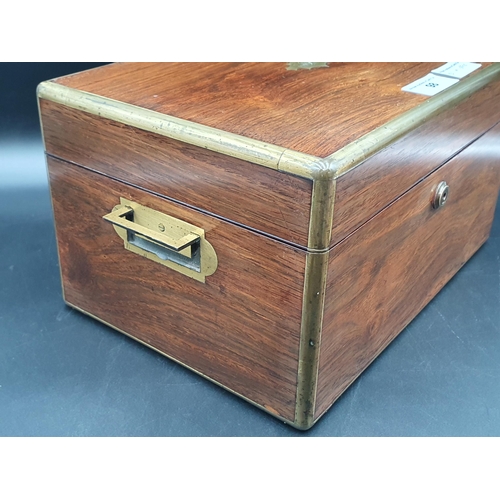 98 - An early Victorian brass bound rosewood Vanity Case with inset brass handles and drawer, containing ... 