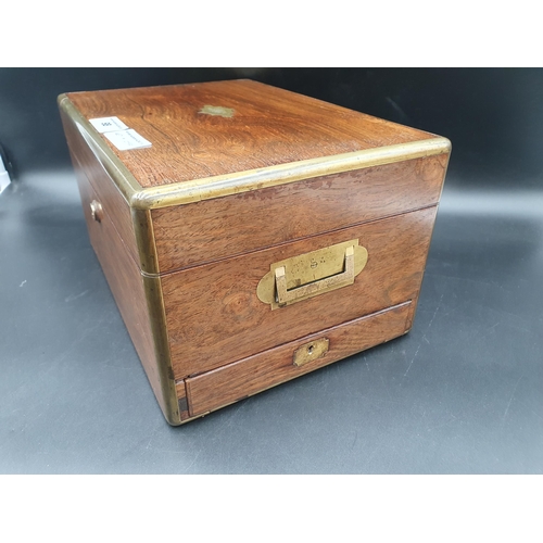 98 - An early Victorian brass bound rosewood Vanity Case with inset brass handles and drawer, containing ... 