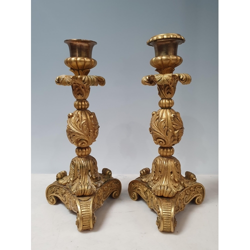 466 - A pair of French ormolu Candlesticks with leafage designs on scrolled supports (One missing its Scon... 