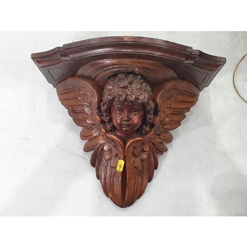 329 - A carved Hanging Winged Cherub Wall Sconce, A/F. (R5).