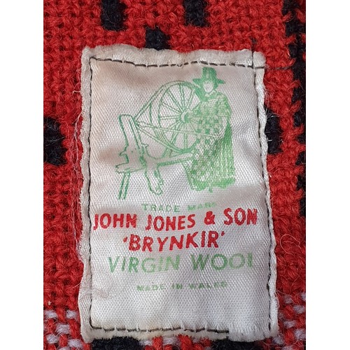 14 - A Welsh woollen Blanket with geometric designs, bearing Label for (John Jones & Son 