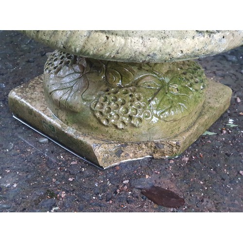 702 - A pair of Sandford low Garden Urns with moulded floral designs on pedestal bases, A/F, (Corner of Pe... 