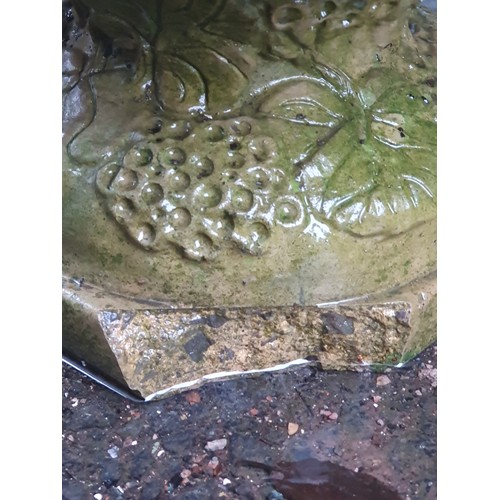 702 - A pair of Sandford low Garden Urns with moulded floral designs on pedestal bases, A/F, (Corner of Pe... 