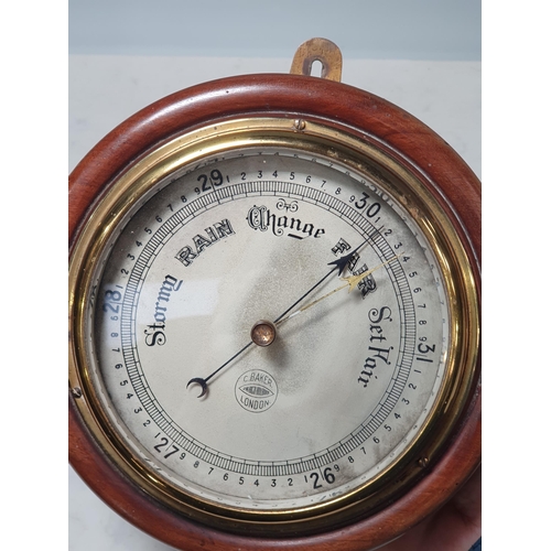 211 - A mahogany and brass cased Aneroid Barometer by 