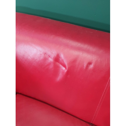 467 - A red leather style Two Seater Sofa on chrome bracket feet A/F, 5ft 2