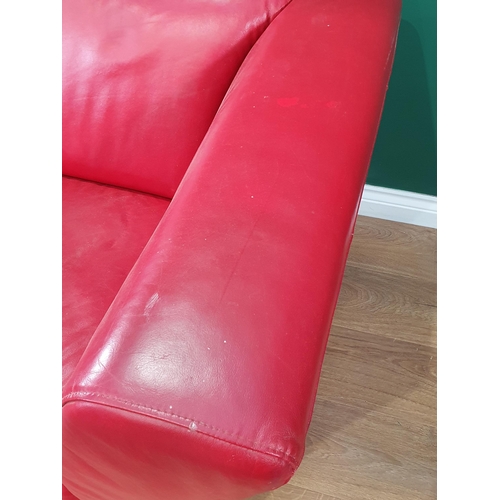 467 - A red leather style Two Seater Sofa on chrome bracket feet A/F, 5ft 2