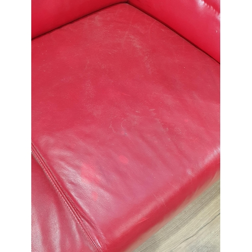 467 - A red leather style Two Seater Sofa on chrome bracket feet A/F, 5ft 2