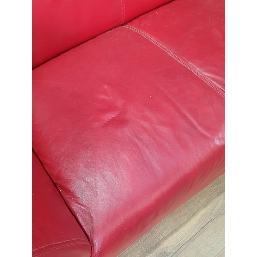 467 - A red leather style Two Seater Sofa on chrome bracket feet A/F, 5ft 2