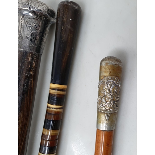 96 - A George V silver mounted Swagger Stick, London 1920, a military Baton, and another made from rings ... 