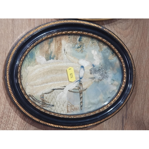 241 - A Embroided picture of a lady on a shoreline with another oval frame