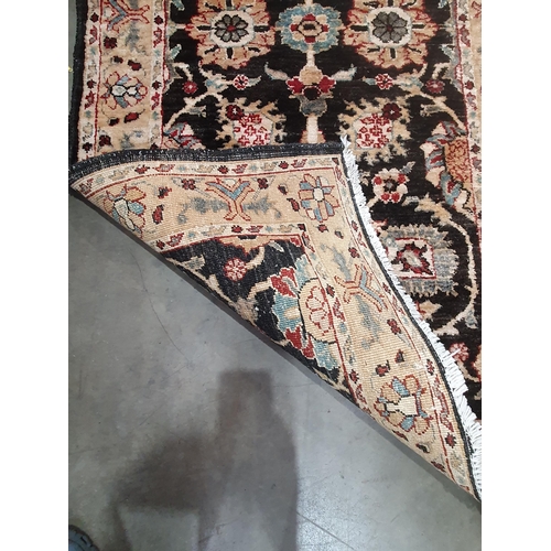 93 - A Runner on beige and brown ground, with multi borders and central floral designs, 9ft 11