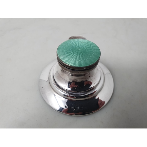 106 - A George V silver and pale green guilloche enamel Capstan Inkwell, Birmingham 1912