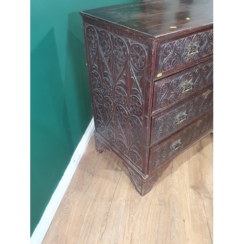 11 - An 18th Century oak Chest of two short, three long Drawers with later carved decorations, raised on ... 