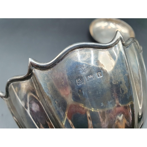 110 - An Edward VII silver shaped circular Bowl engraved coat of arms with motto, Birmingham 1905, and a s... 