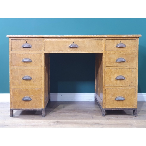 16 - A Scumble painted pine Desk with nine fitted Drawers, and panelled ends, 30