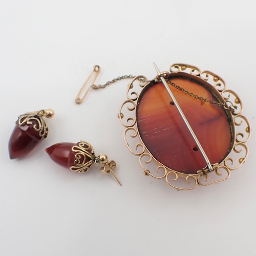 166 - An Agate Brooch set large oval stone in openwork yellow metal frame and a pair of Acorn Earrings on ... 