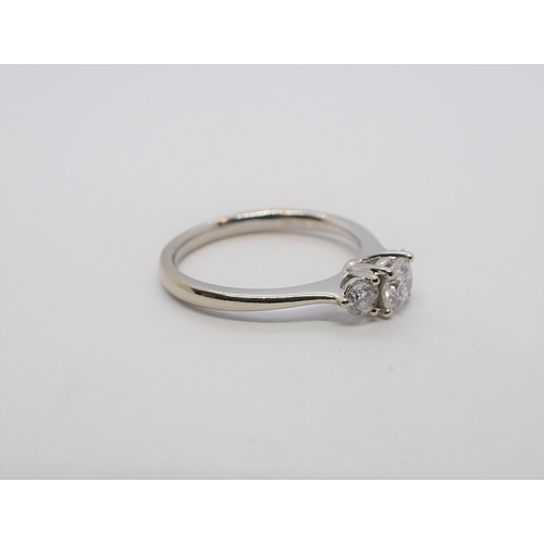 168 - A Diamond three stone Ring claw-set graduated brilliant-cut stones in 18ct white gold, ring size J -... 