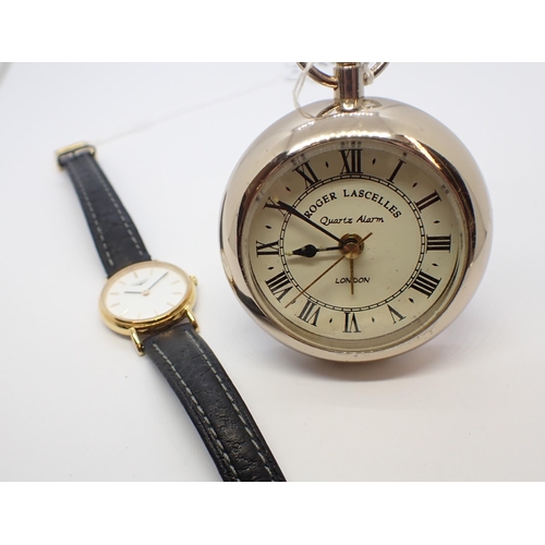 195 - A lady's Longines quartz Wristwatch the white dial with hourly baton markers in gold plated and stai... 