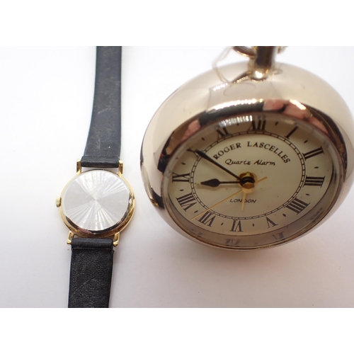 195 - A lady's Longines quartz Wristwatch the white dial with hourly baton markers in gold plated and stai... 