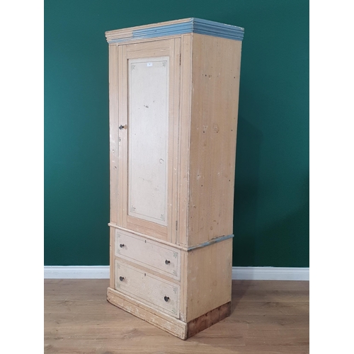 21 - A Victorian scumble painted pine Wardrobe, the panel door above two long drawers, raised on plinth b... 