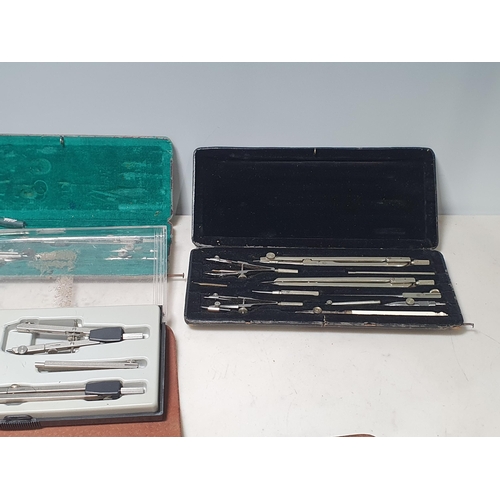 218 - A pair of Tecnar 10 x 50 Binoculars in case, boxed Drawing Instruments, and a set of metal Spats in ... 