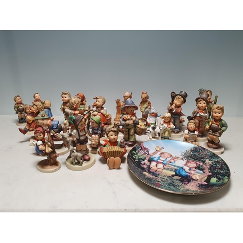 231 - A large Collection of Goebel Hummel Figures.