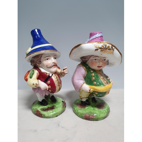 236 - A pair of Derby Mansion House dwarf figures with coloured hats and costume, 6 1/2in H