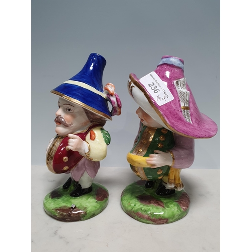 236 - A pair of Derby Mansion House dwarf figures with coloured hats and costume, 6 1/2in H