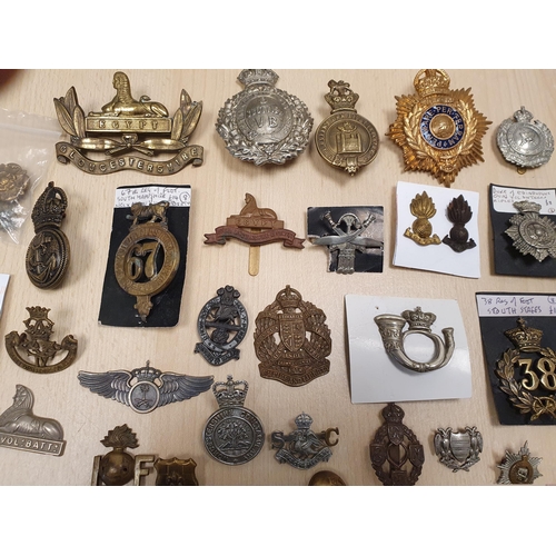 252 - A Collection of Military Badges including Numbered Regiments, Gurkha, etc