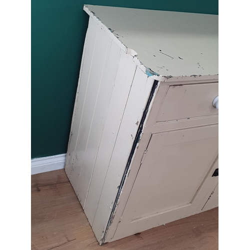 26 - A cream painted Dresser Base fitted three drawers above three panel cupboard doors, 2ft 11