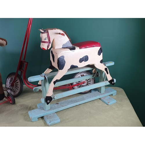 288 - A painted wooden Rocking Horse, 2ft 8in L, a Dog Trolley and a red Scooter (R10)