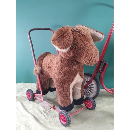 288 - A painted wooden Rocking Horse, 2ft 8in L, a Dog Trolley and a red Scooter (R10)