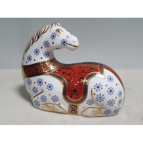 322 - A royal crown derby Paperweight in the form of a seated horse, 5in and another in the form of a bird... 