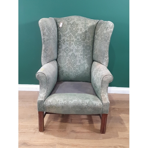 33 - A Georgian style wingback Armchair on moulded front squared supports (R10)