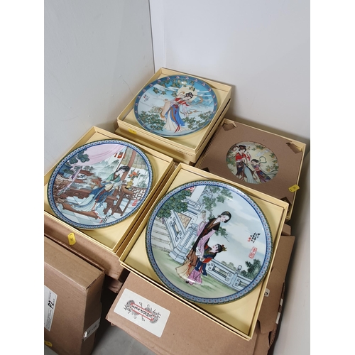 336 - A collection of Oriental Boxed Collectors Plates, which are two complete sets of 12 plates and a mah... 