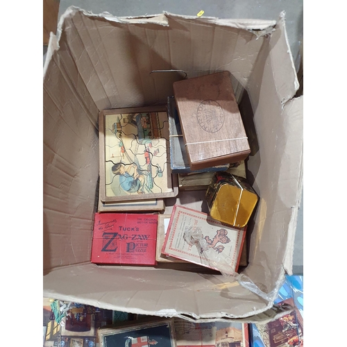 349 - A box of Jigsaw Puzzles and Games. (R5).