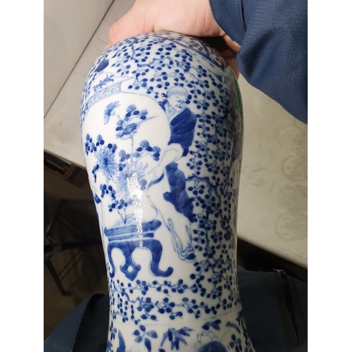 377 - A Chinese blue and white ceramic Vase with figures supporting vases, and all over bird and floral pa... 