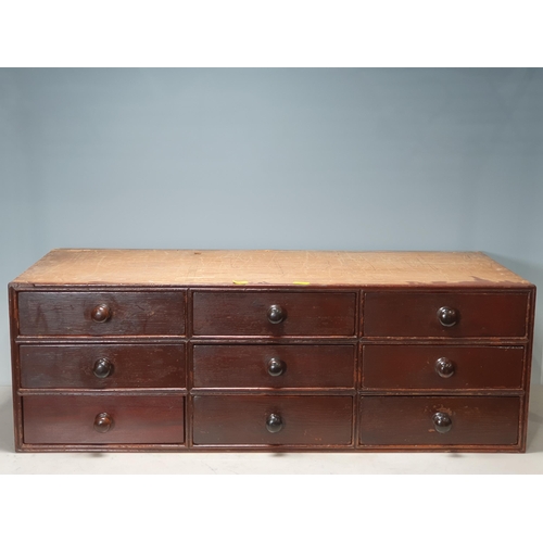 44 - A Bank of Nine stained pine Drawers, 11in High x 2ft 8in Wide x 13in Deep. (R3).