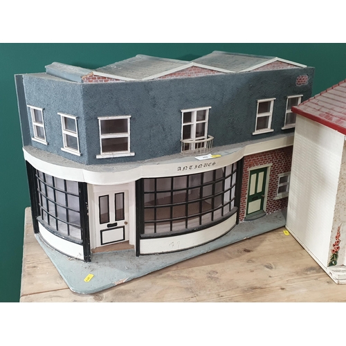 459 - A Dolls House in the form of an Antiques Shop, and another Dolls House A/F. (R2).