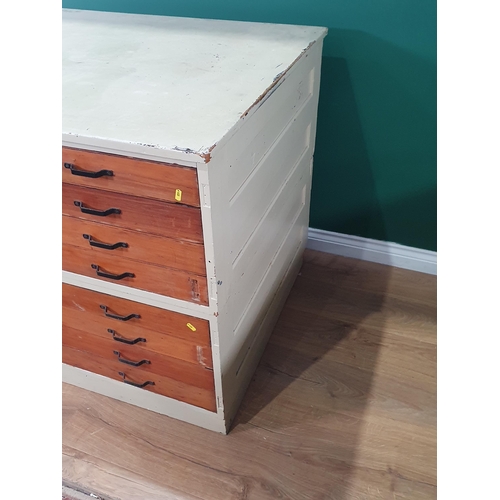 495 - A white painted two section eight drawer Plan Chest on plinth base, 3ft 1