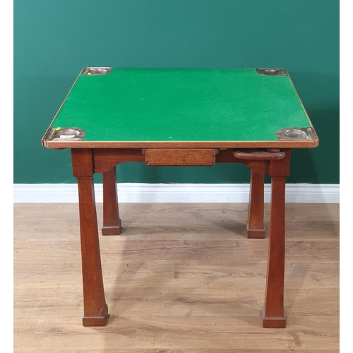 502 - An oak framed Card/Games Table with green felt top, fitted copper counter/piece trays (Reg No. 41021... 