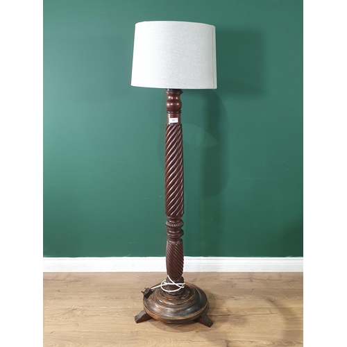 527 - A mahogany Standard Lamp with with twisted column, with later circular stepped base and feet. 4ft 11... 